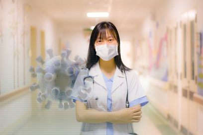 masked healthcare worker next to virus