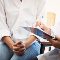 Healthcare medical concept : Doctor / psychiatrist consulting gy Healthcare medical concept : Doctor / psychiatrist consulting gy