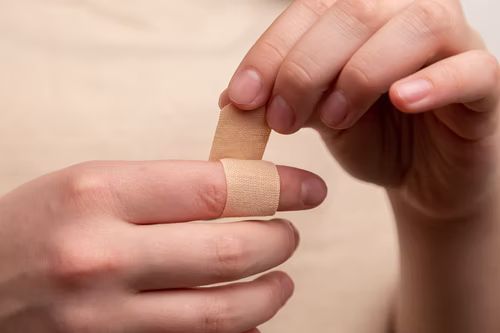 wrapping finger with band-aid