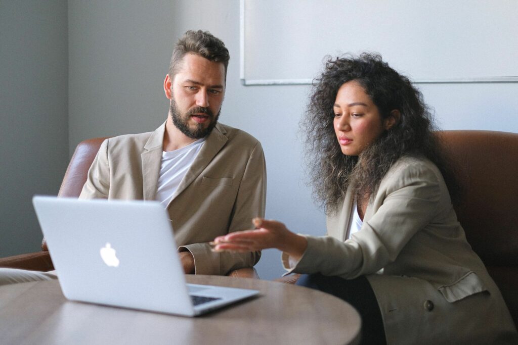 Two People Conferring