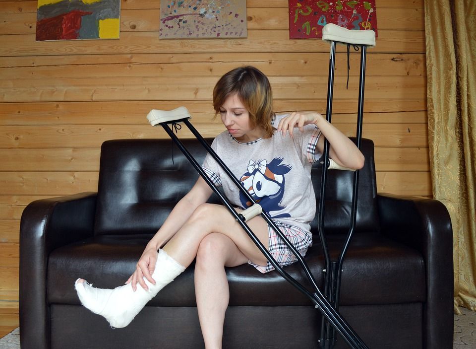 injured woman with crutches