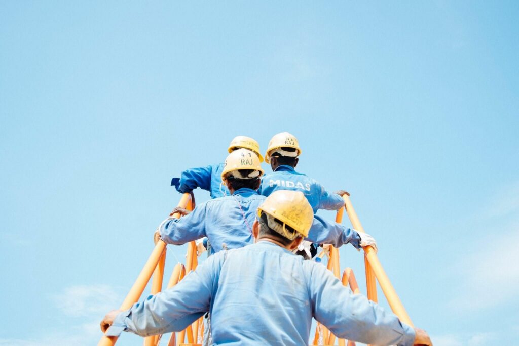 Workers climbing steps