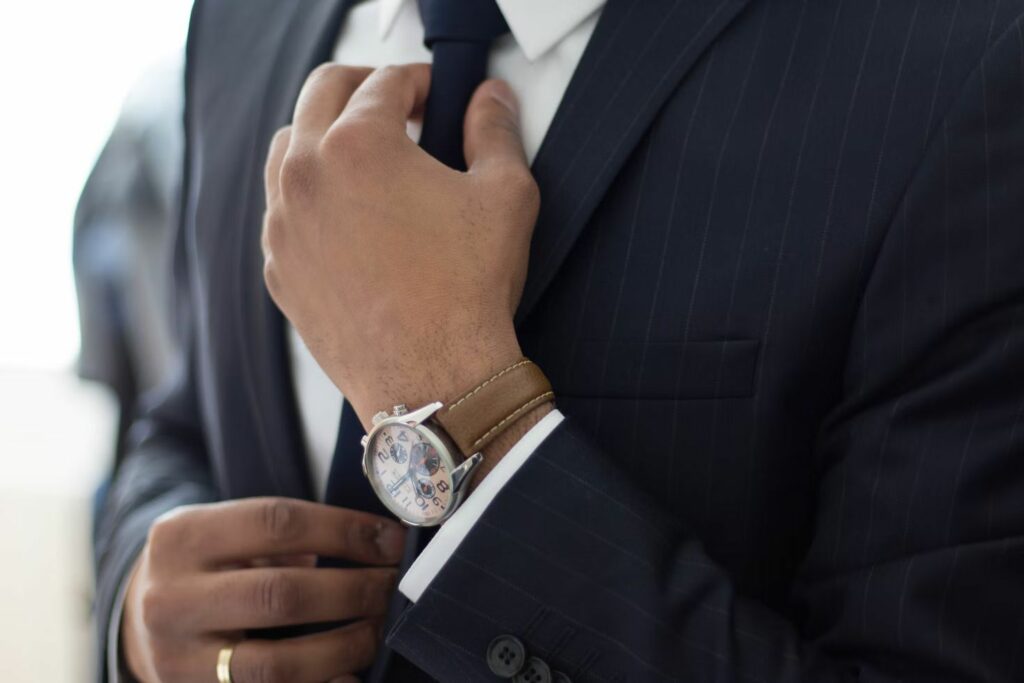 A man adjusting his tie