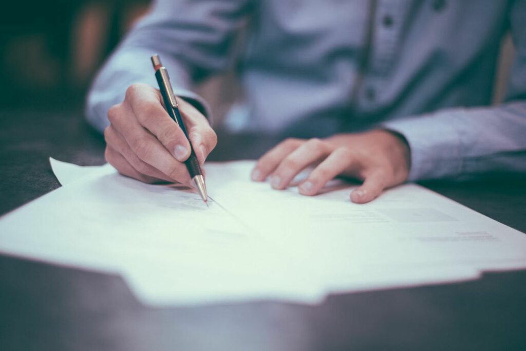 A man filling out paperwork