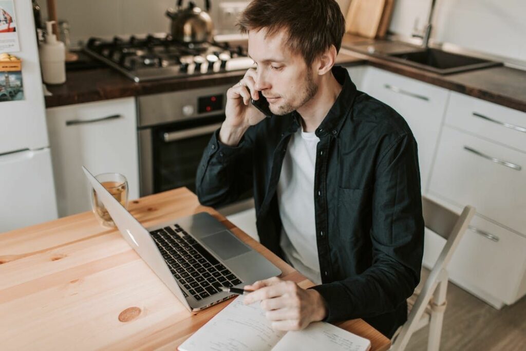 An injured man making a phone call to an attorney 