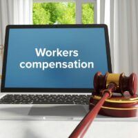Workers compensation. Law. A lawyer laptop on a desk in the offi