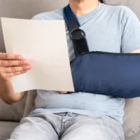 Reading letter about Injury and compensation paperwork, insurance, legal contract or lawyer consulting.Disability people, attorney or advocate in negotiation,policy advice or accident report closeup
