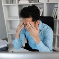 struggling-with-office-syndrome-employee-stress-relief-strategies-in-workspaces-professional-environment-closeup-view