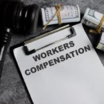 concept-of-workers-compensation-write-on-paperwork-isolated-on-wooden-table